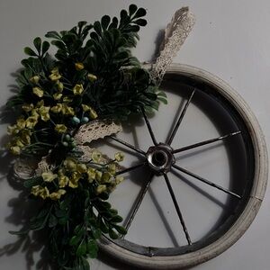 Decorative Wheel with Greenery and Yellow Flowers
